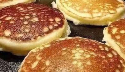 golden pancakes drizzled with syrup